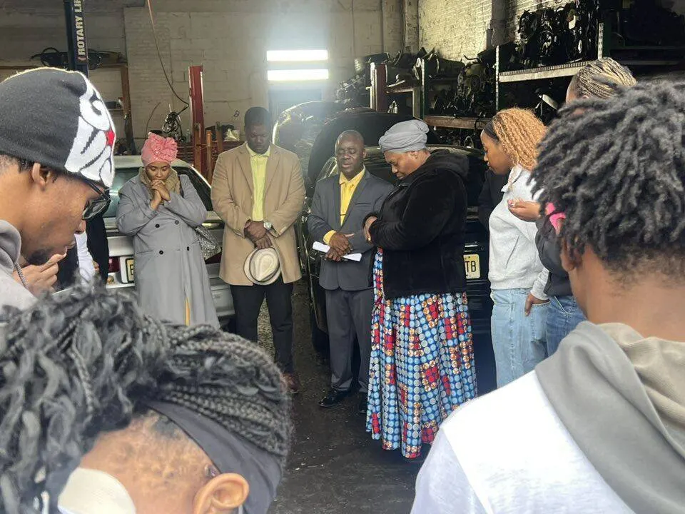 Prayer circle with community members